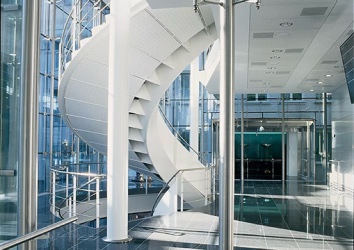 Glass atrium and spiral staircase at UBS Grünenhof